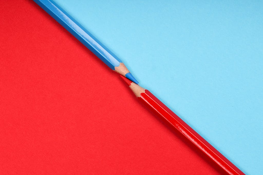 Blue Pencil on Red Surface